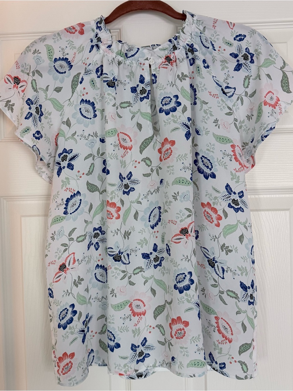 Ann Taylor White Floral Short-Sleeve Blouse with Blue, Pink, and Green Print.